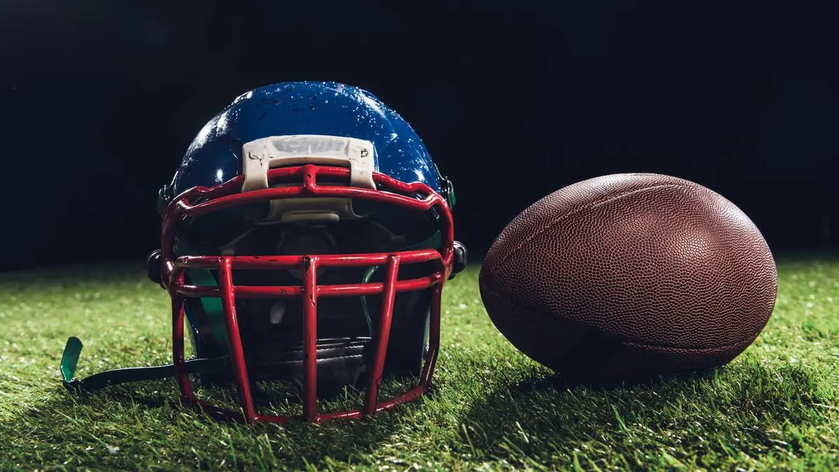 american football helmet and ball